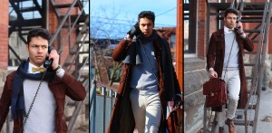 一个男人用老式无绳电话说话，电话装在一个皮革公文包里