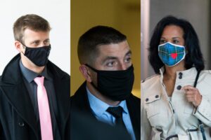 三名蒙面警察，两个男人和一个女人，穿着平民衣服。