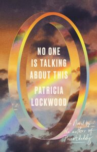 Patricia Lockwood的书的书籍封面没有人在谈论这个。这是一个可爱的扭曲半透明环的漂亮拍摄的插图，漂浮在Midair中，带着日落，浅云和一次彩虹，并在戒指的标题和作者的名字中位于戒指的中心。