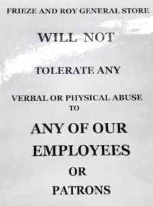 Frieze和Roy General商店的层压标志警告顾客滥用行为。