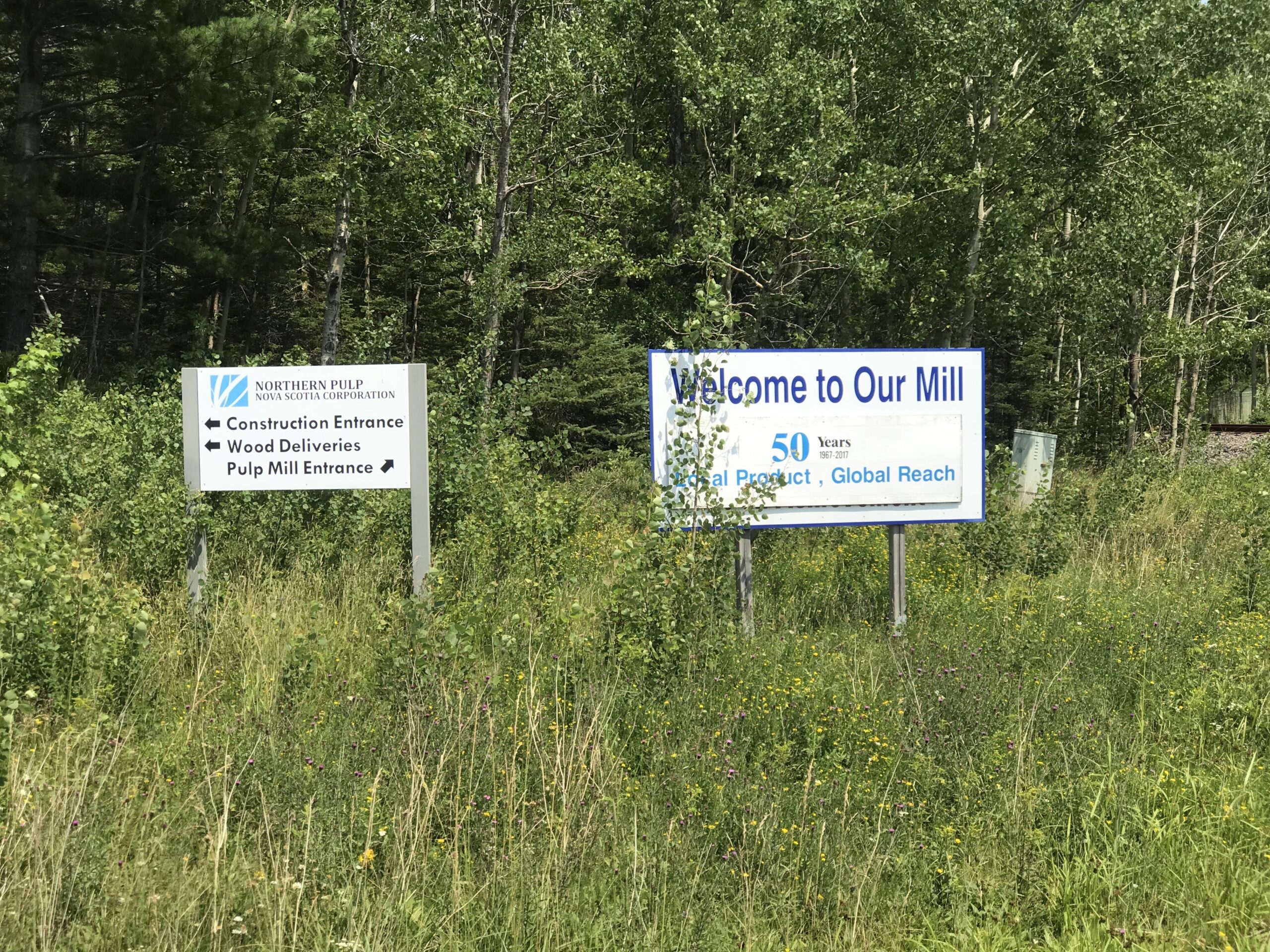 Sign at entrance to Northern Pulp mill saying Welcome to Our Mill.