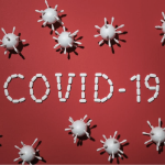 Covid 10用红色背景的白色药丸拼出。