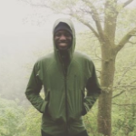 Chúk Odenigbo in the woods on a foggy day.