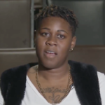 凯拉波登,一个年轻的黑人女性,解决了camera.