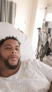 R and B artist Kaleb Simmonds lying in a hospital bed after experiencing chest pains.