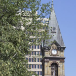 The clock at City Hall on a clear August day in 2020