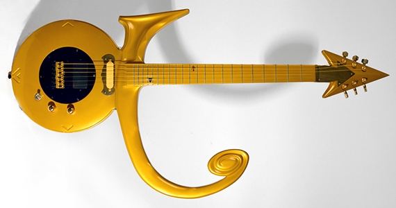 a photo of a yellow guitar