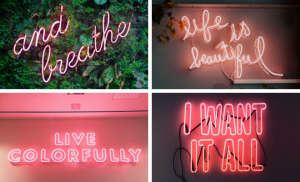 四个粉红色的霓虹灯招牌被点亮了。第一个是“呼吸”。第二条写着“生活是美丽的。”第三条是“活得丰富多彩”。第四个说:“我都想要。”