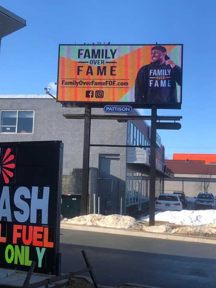 Large outdoor Family Over Fame billboard on Main Street in Dartmouth