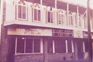Old black and white photo of a two story building