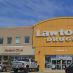 the outside of a Lawton's Drugs with a medical clinic beside it