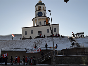 Citadel Hill and a number of Canada flag-waving protestors.