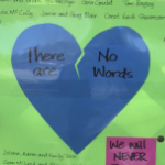 一张海报，明亮的绿色背景上有一颗蓝色的破碎的心