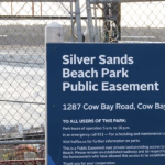 A sign for the Silver Sands Beach park public easement