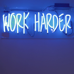 A blue neon sign whiich reads 