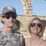 young white man and woman smiling in sunglasses