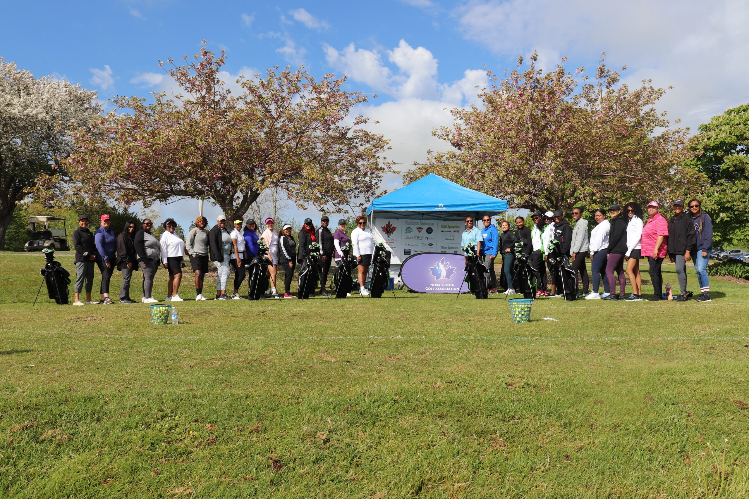 A group photo of Black female golfers on the golf course