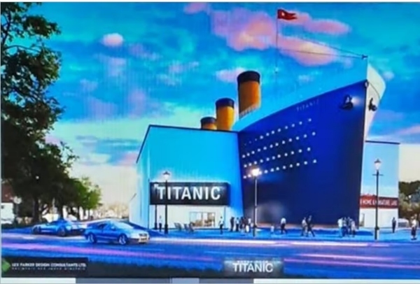 拟建博物馆的效果图，该博物馆的建筑看起来像泰坦尼克号的复制品，顶部有食物堆栈。在入口上方有一个写着“泰坦尼克号”的标志。
