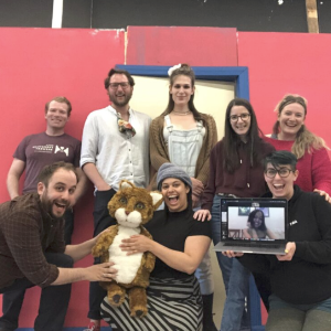 A group of 8 theatre performers mugging for the camera