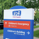 The white red and blue sign of the IWK hospital
