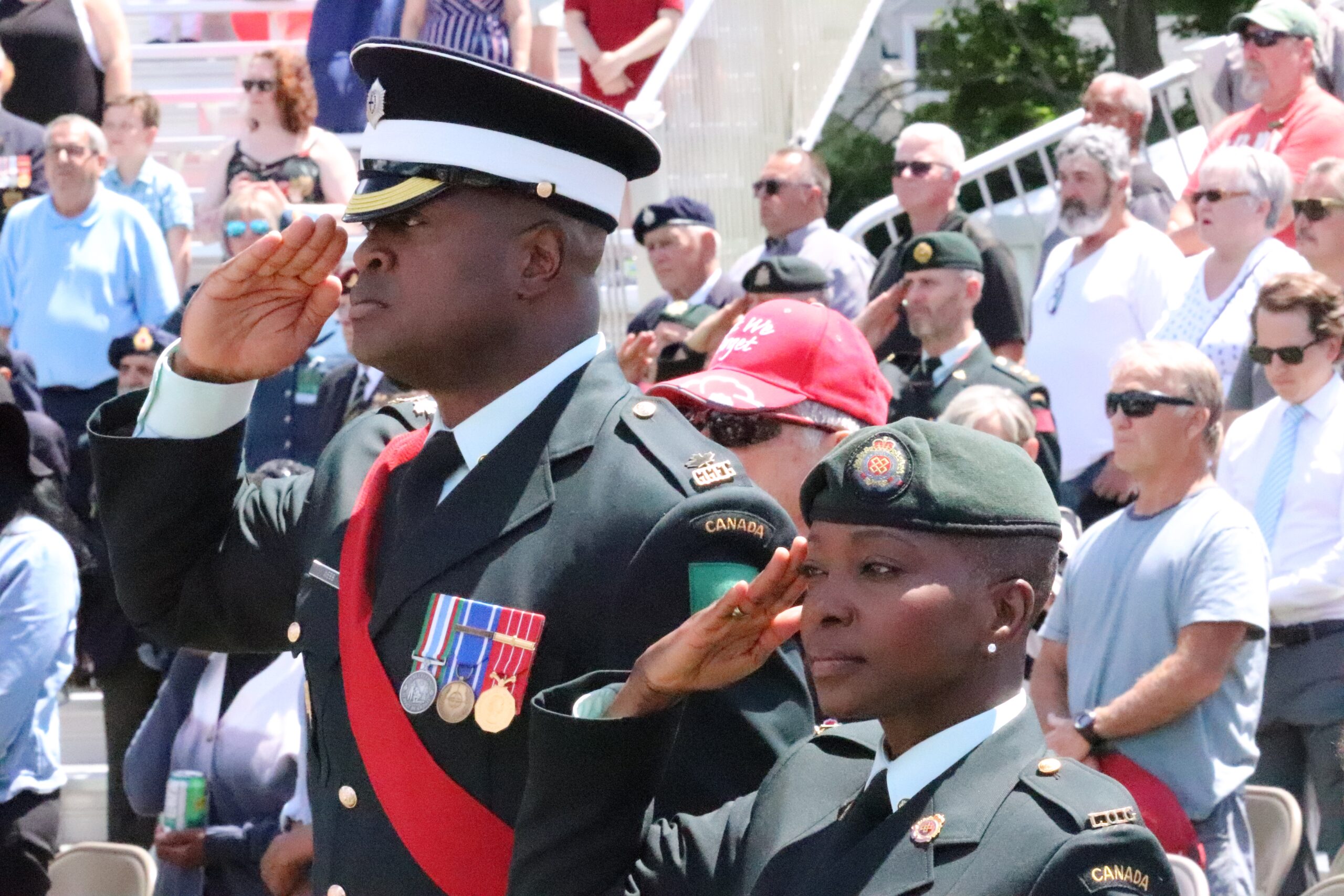 Two military servicepeople give a salute.